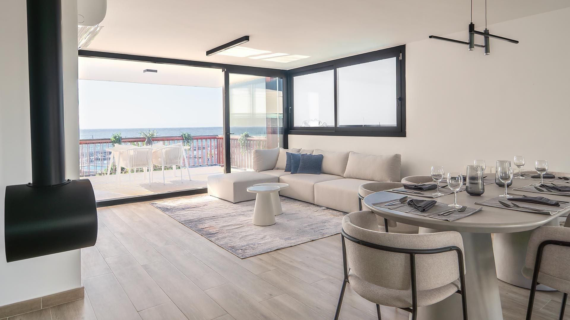 Sala d'estar de Pis en venda en Sant Andreu de Llavaneres amb Jardí privat, Terrassa i Piscina comunitària