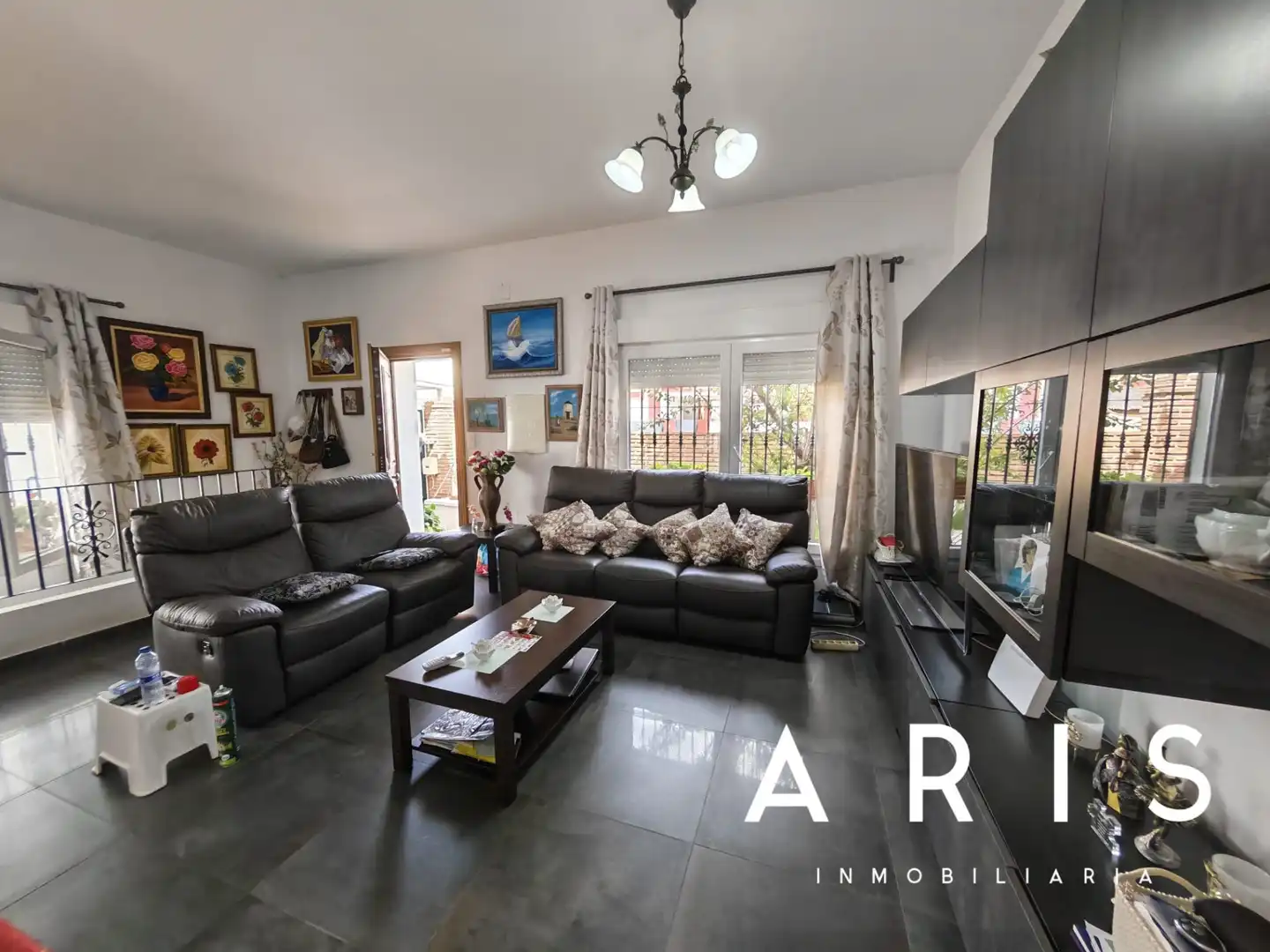 Sala de estar de Casa adosada en venta en Alhaurín de la Torre con Aire acondicionado y Piscina
