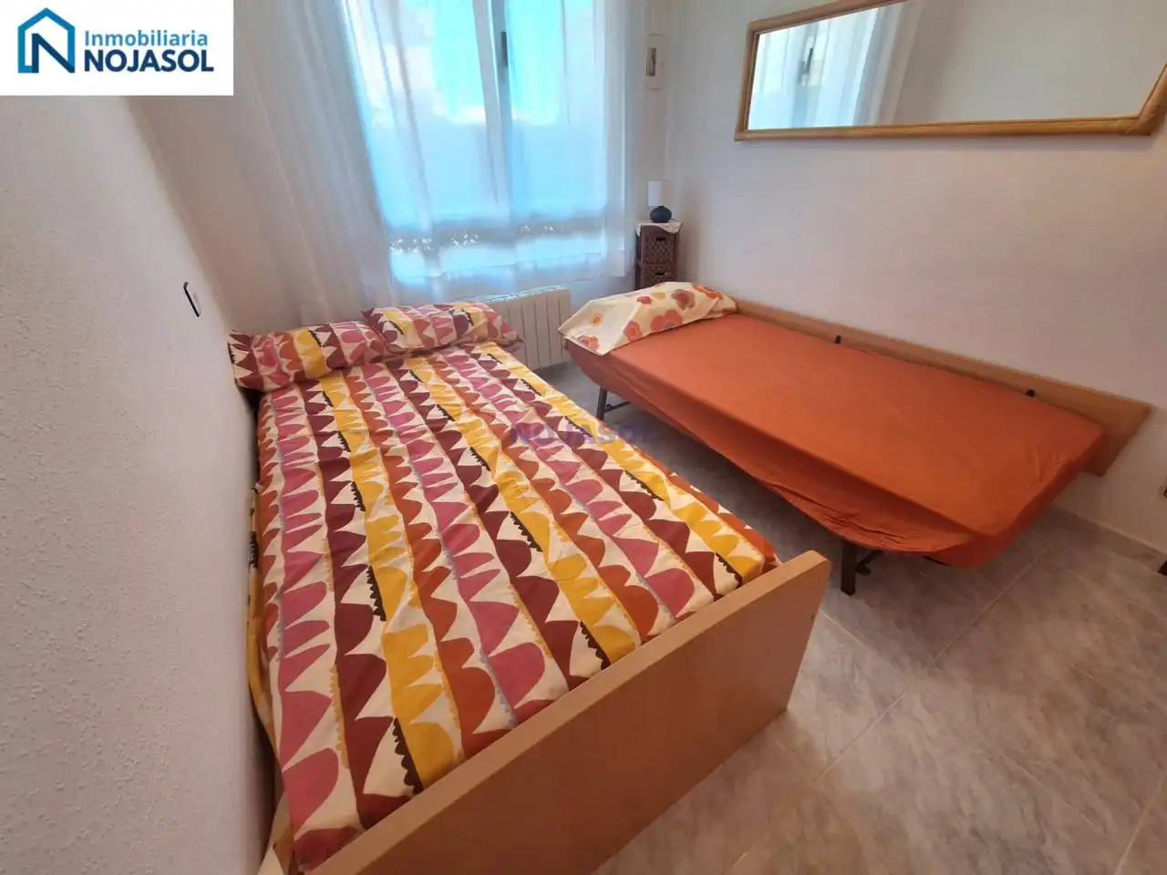 Dormitori de Apartament de lloguer en Noja amb Calefacció, Jardí privat i Terrassa