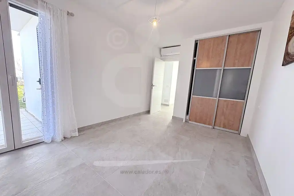 Schlafzimmer von Wohnungen zum Verkauf in Santanyí mit Klimaanlage, Privatgarten und Terrasse