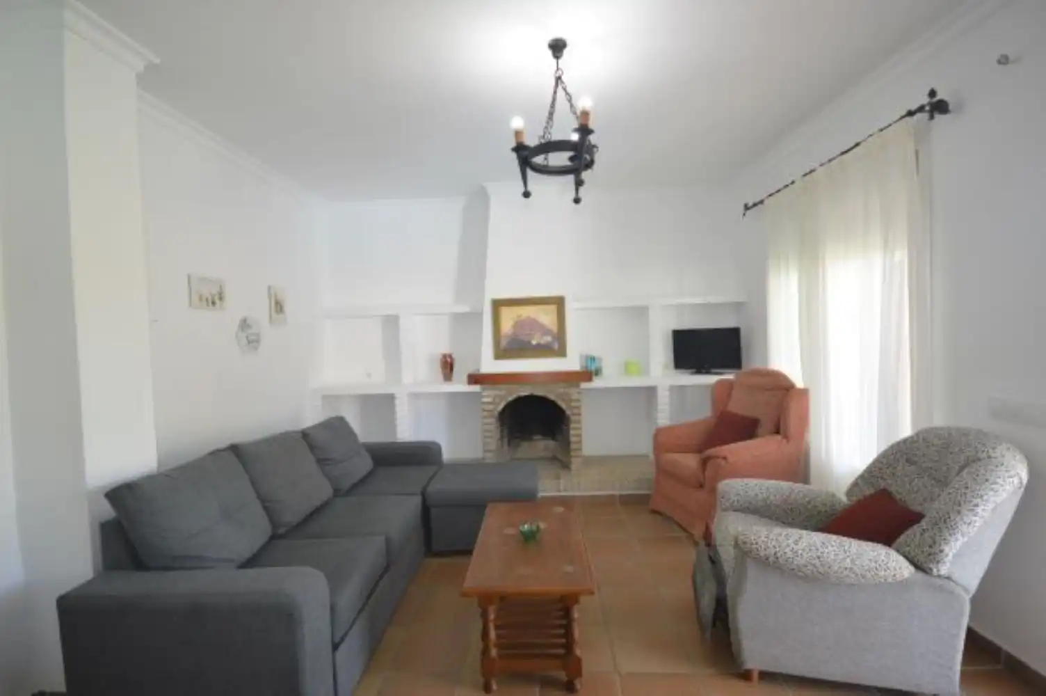 Sala de estar de Casa adosada de alquiler en Conil de la Frontera con Aire acondicionado, Jardín privado y Terraza