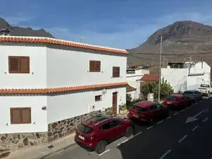 Vista exterior de Casa adosada en venda en Mogán amb Jardí privat, Piscina i Moblat