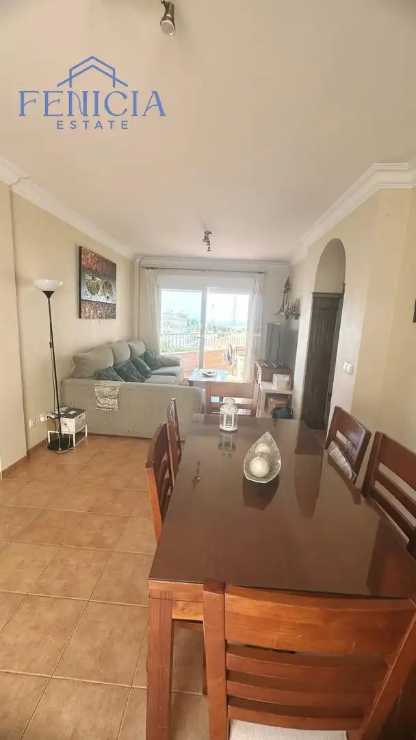Sala de estar de Casa adosada en venta en Nerja con Jardín privado, Terraza y Piscina comunitaria