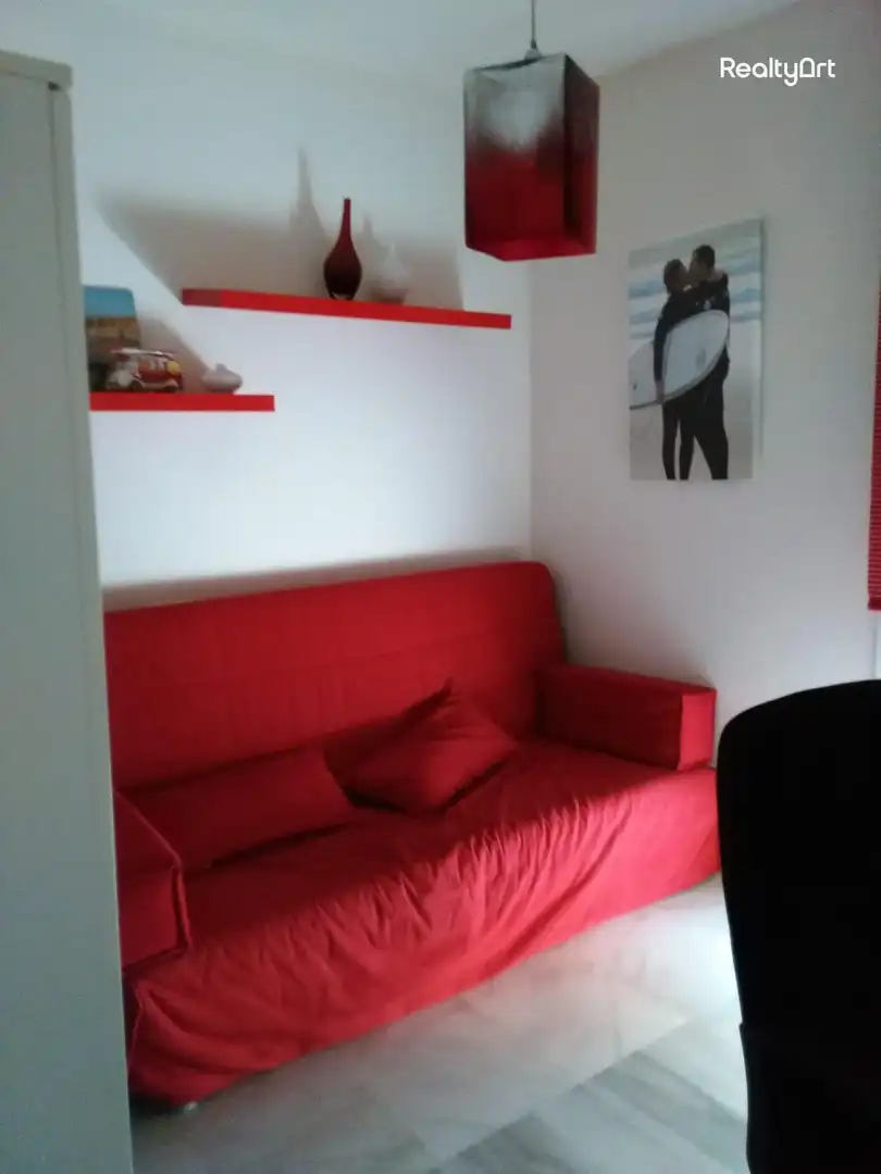 Sala de estar de Casa adosada en venta en Umbrete con Aire acondicionado, Calefacción y Jardín privado