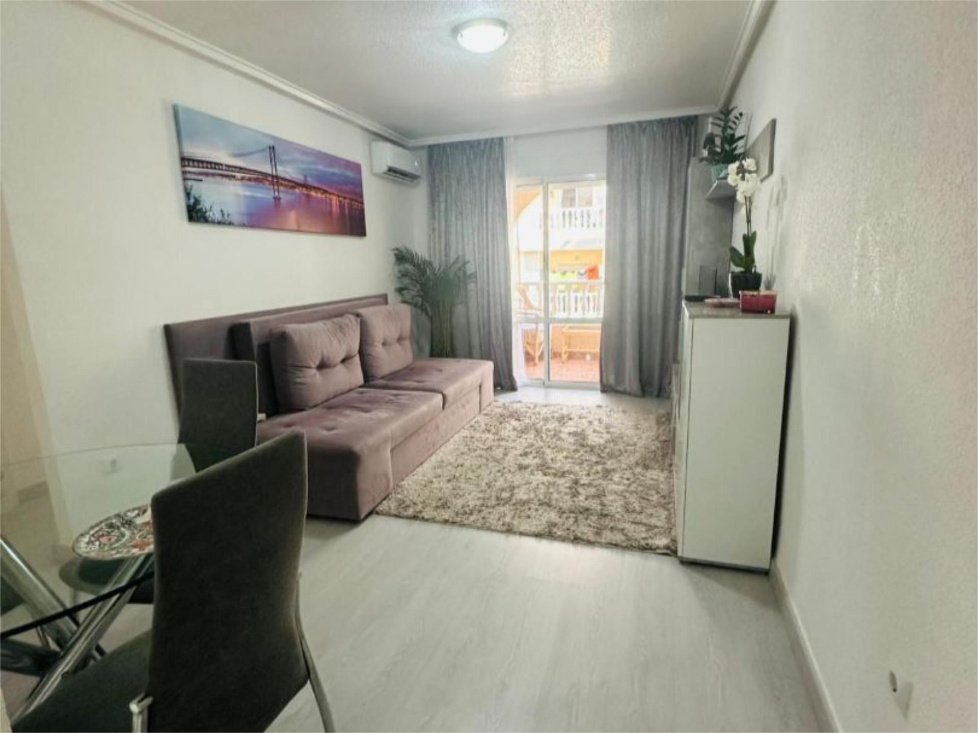 Living room of Flat for sale in Torrevieja  with Air Conditioner, Private garden and Swimming Pool