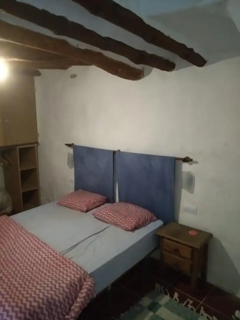 Casa adosada en venta en Válor Habitación de Casa adosada en venta en Válor con Terraza