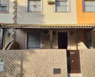 Exterior view of Single-family semi-detached for sale in La Algaba  with Air Conditioner and Terrace