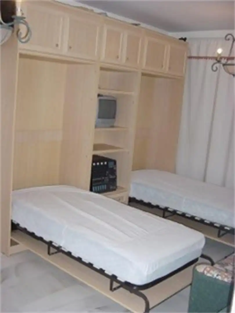 Apartament de lloguer a Calle El Erizo, Costa Ballena - Largo Norte Dormitori de Apartament de lloguer en Rota amb Calefacció, Terrassa i Piscina