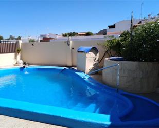 Swimming pool of Single-family semi-detached for sale in Cartaya  with Terrace and Swimming Pool