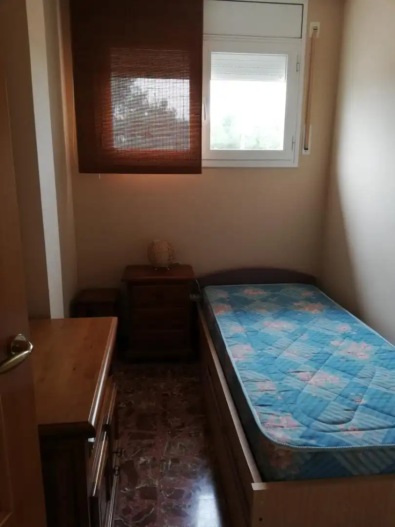 Schlafzimmer von Erdgeschoss zum Verkauf in El Perelló mit Klimaanlage, Heizung und Privatgarten