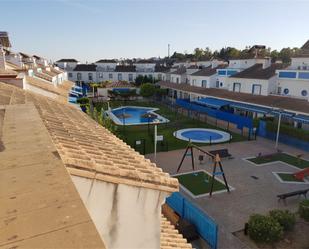 Exterior view of Single-family semi-detached for sale in Coria del Río  with Air Conditioner, Terrace and Swimming Pool