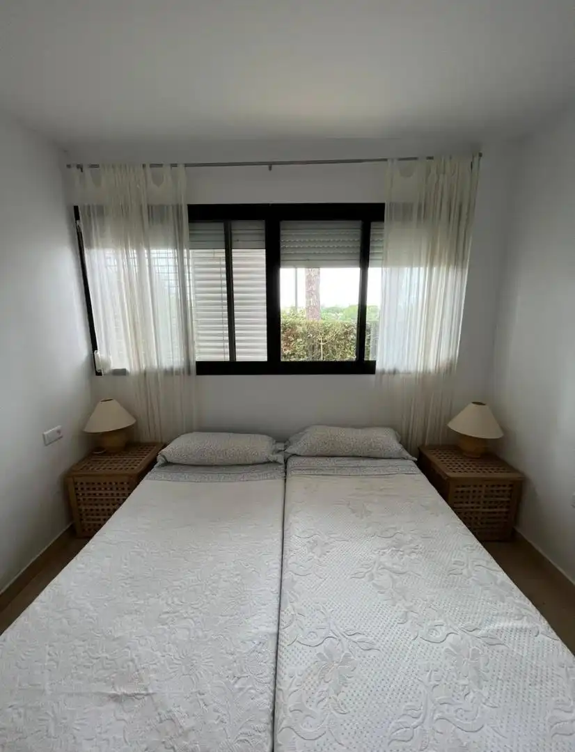 Dormitori de Casa adosada de lloguer en La Antilla amb Jardí privat, Piscina i Moblat