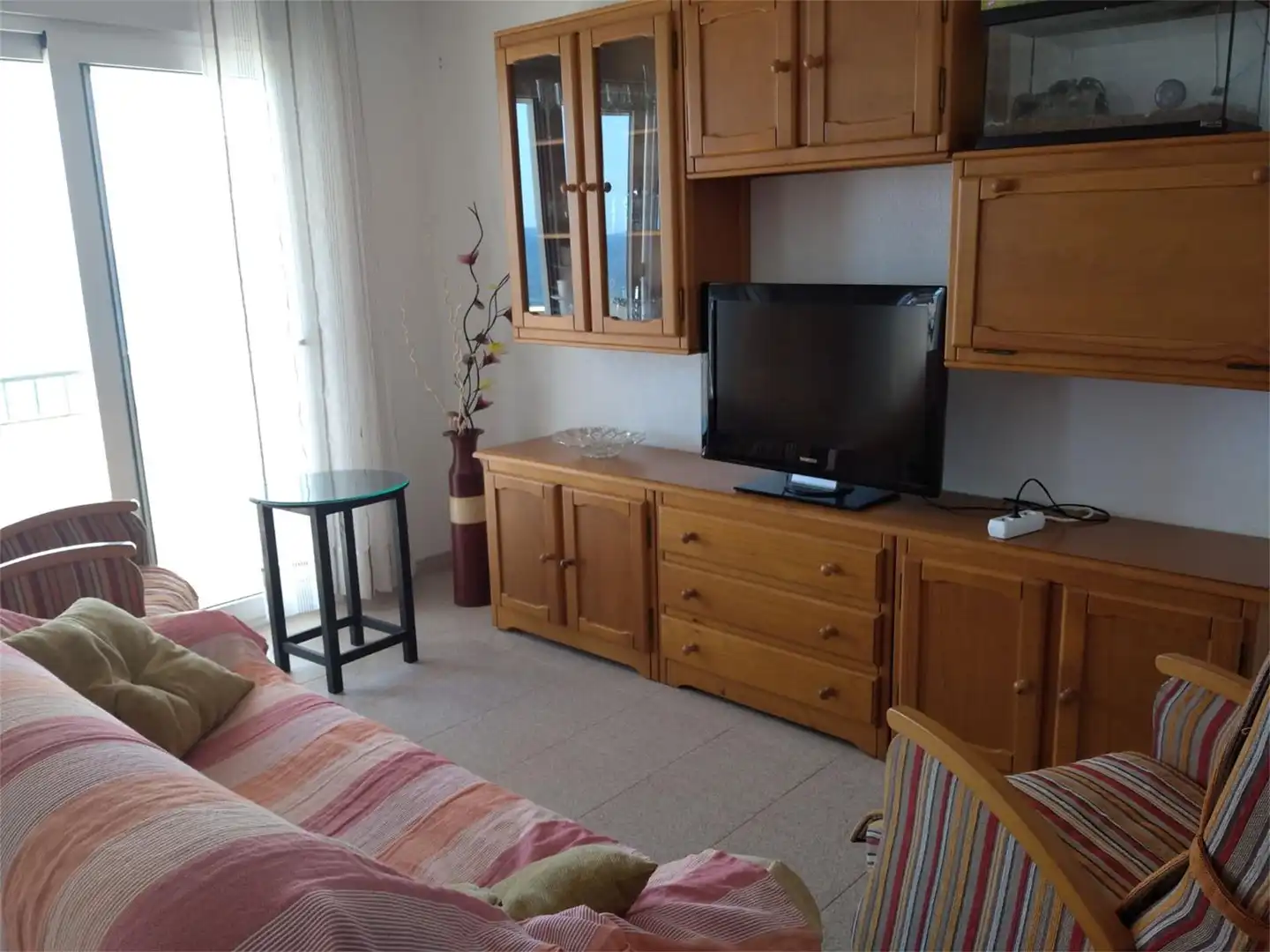 Apartament de lloguer a Edif.playa, 1, Mil Palmeras Sala d'estar de Apartament de lloguer en Pilar de la Horadada amb Jardí privat, Terrassa i Moblat