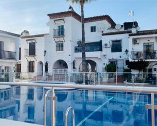 Exterior view of Single-family semi-detached for sale in Nerja  with Air Conditioner, Terrace and Swimming Pool