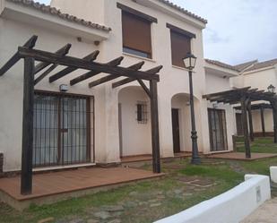 Exterior view of Single-family semi-detached for sale in El Ronquillo  with Air Conditioner, Terrace and Swimming Pool