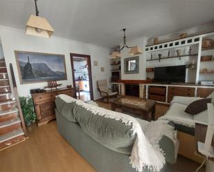 Sala d'estar de Casa adosada de lloguer en Punta Umbría amb Aire condicionat, Terrassa i Piscina