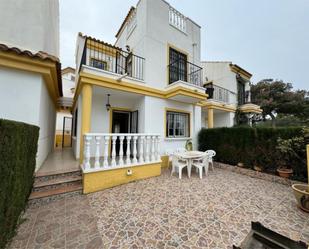 Exterior view of Single-family semi-detached for sale in Guardamar del Segura  with Private garden, Terrace and Furnished