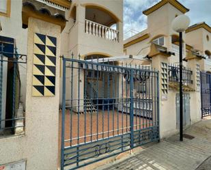 Exterior view of Single-family semi-detached for sale in Guardamar del Segura  with Air Conditioner and Swimming Pool