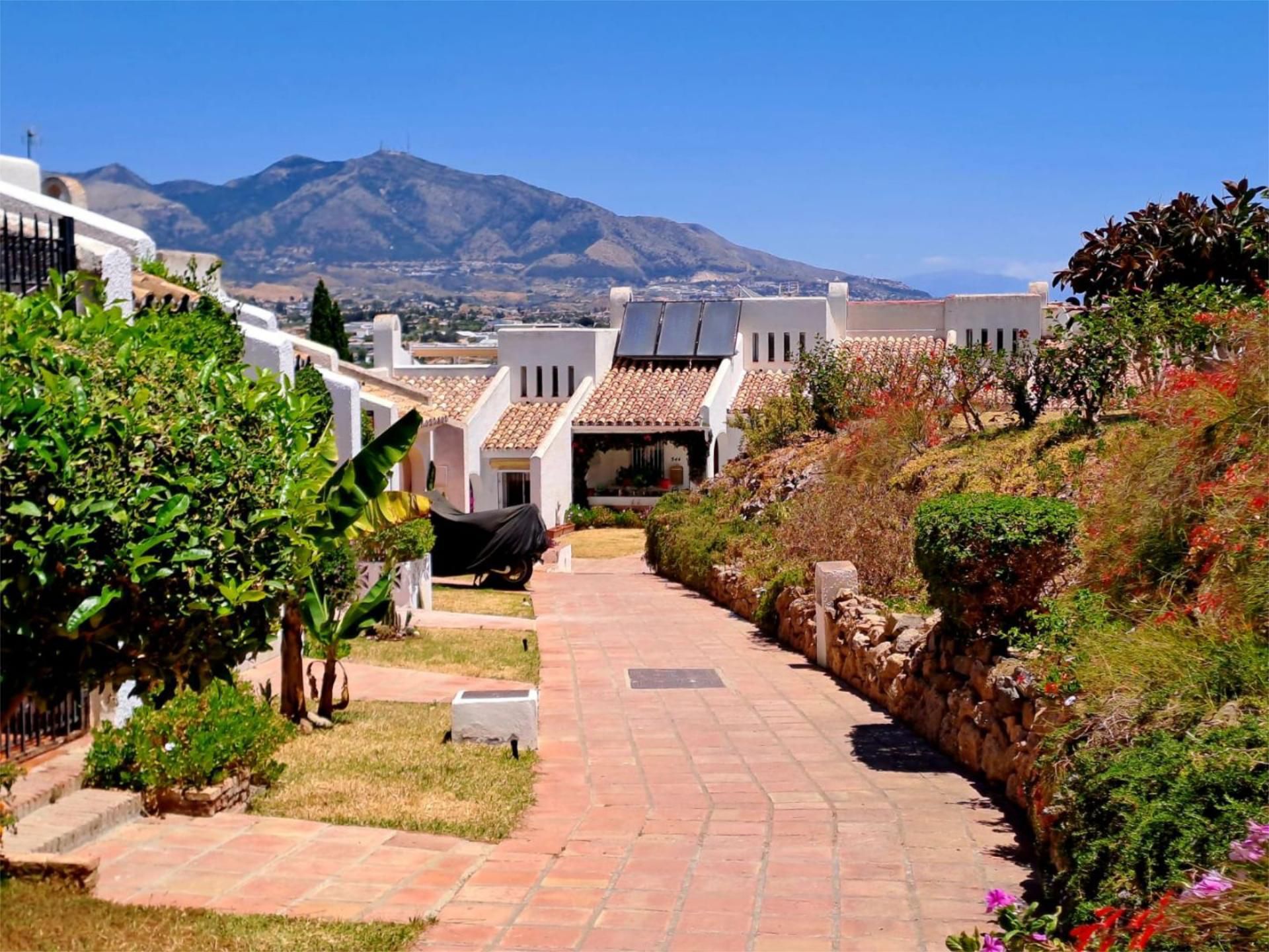 Exterior view of Single-family semi-detached for sale in Mijas  with Air Conditioner, Terrace and Swimming Pool
