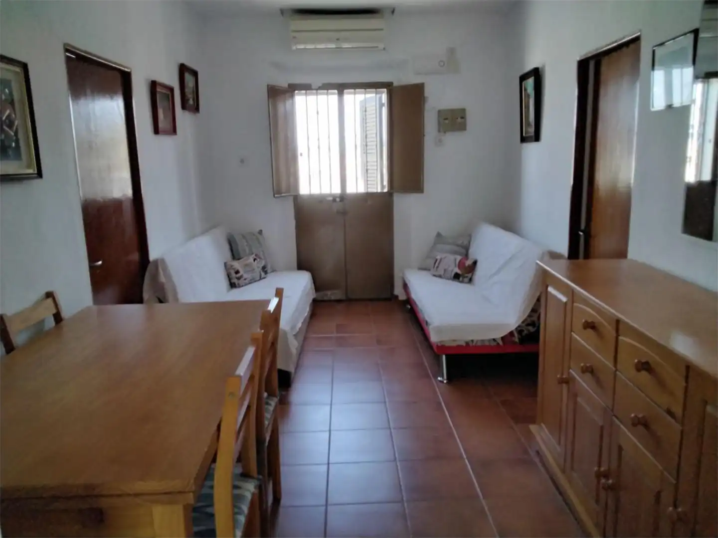 Sala de estar de Casa adosada en venta en Villanueva del Río y Minas con Aire acondicionado, Calefacción y Amueblado