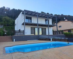 Swimming pool of Flat for sale in Bigues i Riells  with Air Conditioner, Heating and Private garden