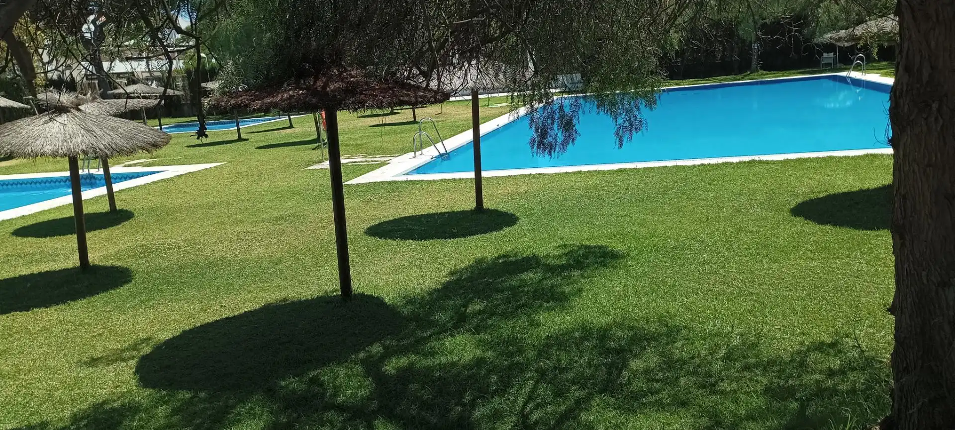 Swimming pool of Flat for rent in Punta Umbría  with Air Conditioner, Heating and Private garden