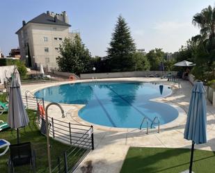 Swimming pool of Flat for sale in  Madrid Capital  with Air Conditioner