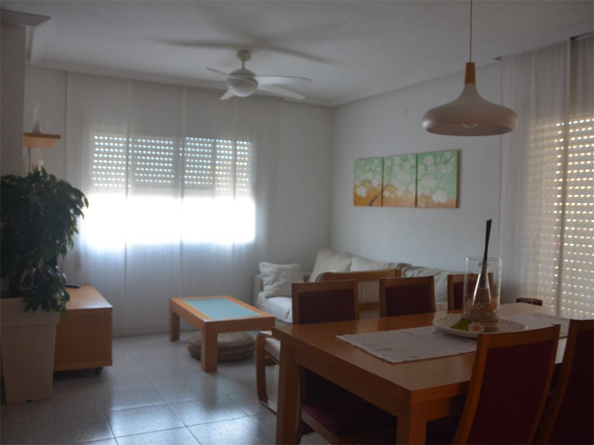Sala d'estar de Dúplex en venda en L'Aldea amb Aire condicionat, Jardí privat i Terrassa