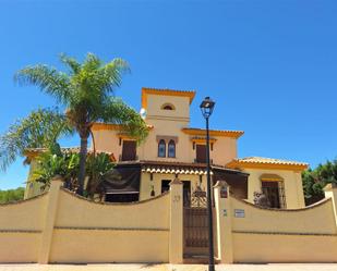 Exterior view of House or chalet for sale in Aljaraque  with Air Conditioner, Terrace and Swimming Pool