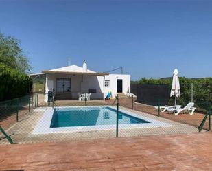 Swimming pool of House or chalet for sale in Lora del Río  with Air Conditioner and Swimming Pool