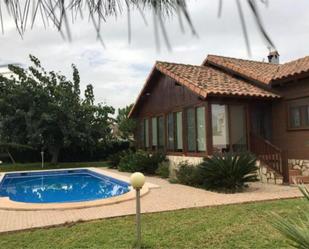 Garten von Einfamilien-Reihenhaus miete in Palma de Gandia mit Terrasse und Schwimmbad