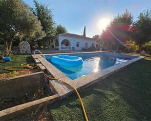 Vista exterior de Casa adosada en venda en Manzanares amb Terrassa i Piscina