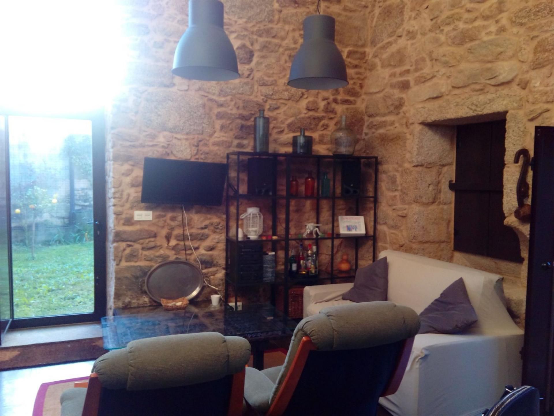 Sala d'estar de Casa o xalet en venda en Ribeira amb Calefacció, Jardí privat i Parquet