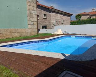 Swimming pool of House or chalet for sale in Sanxenxo  with Air Conditioner, Terrace and Swimming Pool