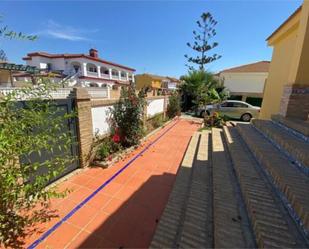 Vista exterior de Casa adosada en venda en Almonte amb Terrassa i Piscina