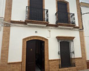 Vista exterior de Casa adosada en venda en San Juan del Puerto amb Aire condicionat, Calefacció i Jardí privat