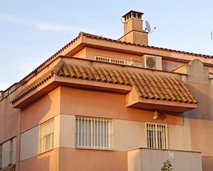 Exterior view of Single-family semi-detached for sale in Aljaraque  with Air Conditioner, Terrace and Swimming Pool