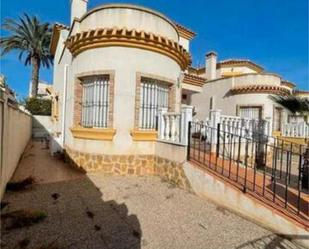 Exterior view of Single-family semi-detached for sale in Guardamar del Segura  with Terrace and Swimming Pool