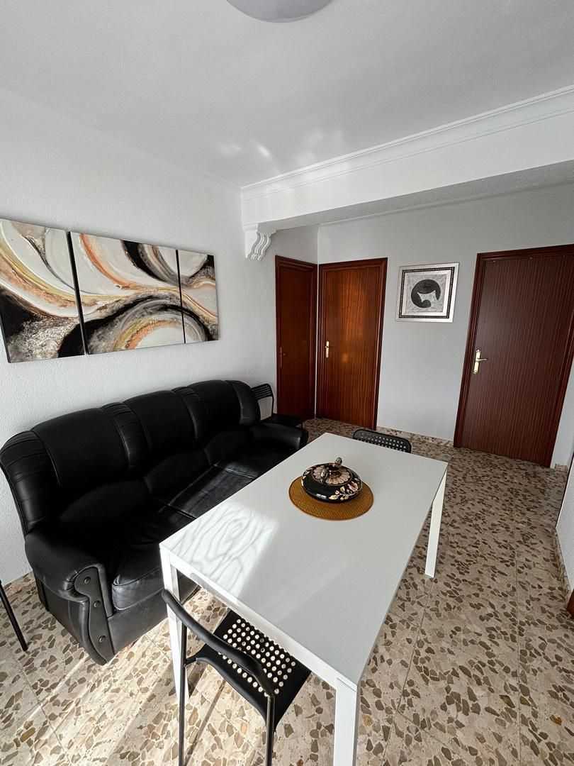 Sala d'estar de Pis per a compartir en  Sevilla Capital amb Aire condicionat, Terrassa i Moblat