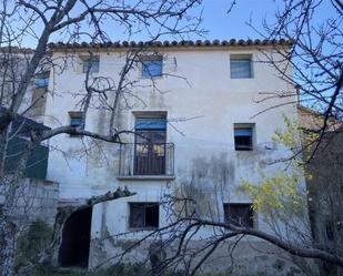 Vista exterior de Casa adosada en venda en Pertusa amb Jardí privat, Traster i Moblat