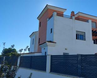 Exterior view of Single-family semi-detached for sale in Aljaraque  with Air Conditioner and Swimming Pool