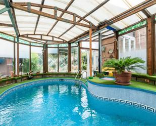 Swimming pool of House or chalet for sale in  Madrid Capital  with Air Conditioner, Heating and Private garden