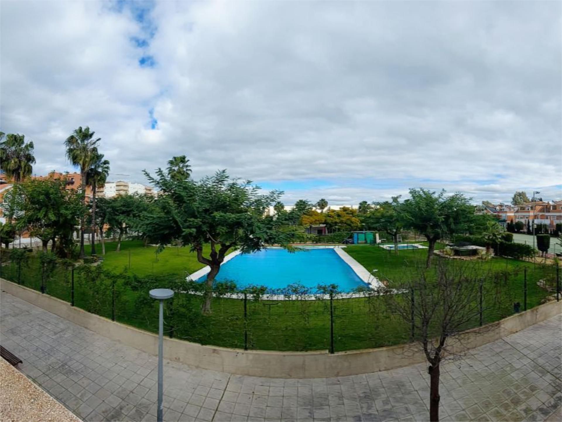 Swimming pool of Single-family semi-detached for sale in  Huelva Capital  with Air Conditioner, Heating and Private garden