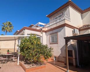 Exterior view of Single-family semi-detached for sale in San Fulgencio  with Air Conditioner, Terrace and Swimming Pool