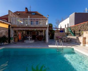 Swimming pool of Single-family semi-detached for sale in  Madrid Capital  with Air Conditioner, Heating and Private garden