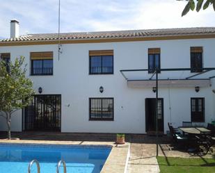 Vista exterior de Finca rústica en venda en El Pedroso amb Aire condicionat, Calefacció i Jardí privat