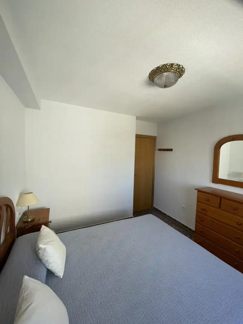 Schlafzimmer von Wohnung zum Verkauf in Cullera mit Klimaanlage, Terrasse und Schwimmbad