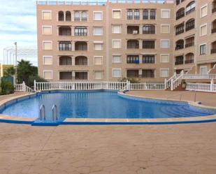 Piscina de Pis de lloguer en Guardamar del Segura amb Aire condicionat, Piscina i Moblat