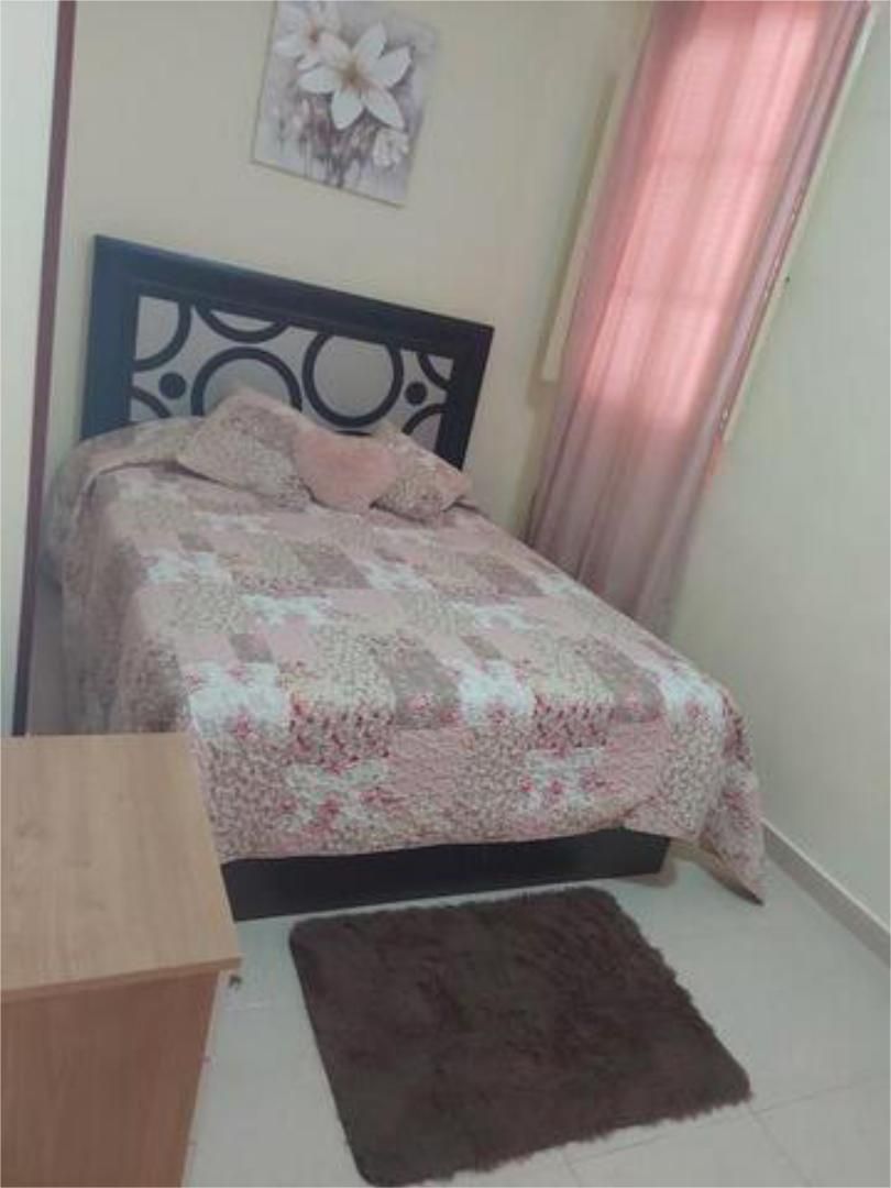 Dormitori de Apartament de lloguer en  Huelva Capital amb Jardí privat i Terrassa