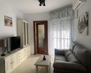 Sala d'estar de Pis de lloguer en El Portil amb Aire condicionat, Terrassa i Moblat